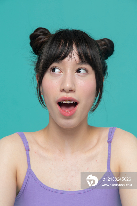 Studio portrait of surprised girl