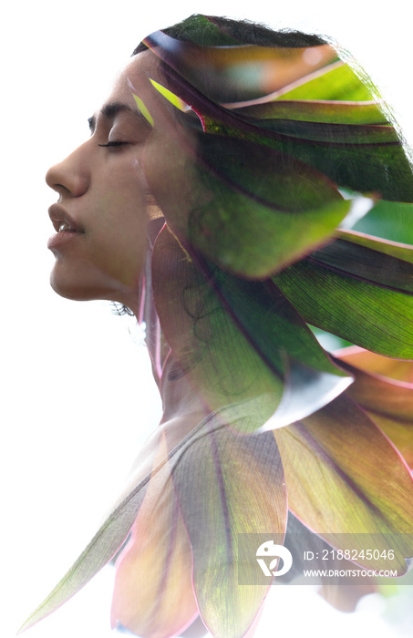 A double exposure portrait young woman profile with her eyes closed against white background and colorful tropical eaves