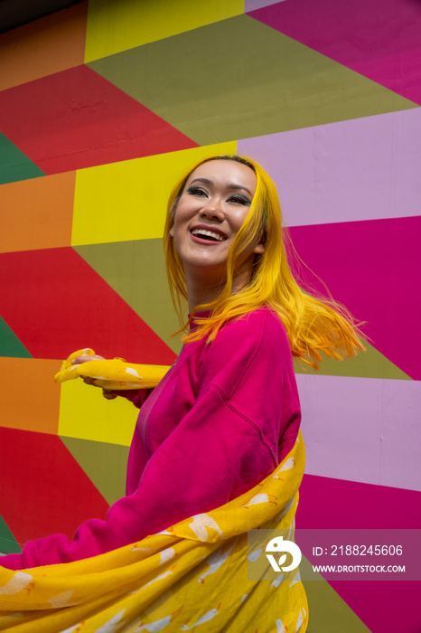 Smiling young woman with yellow hair