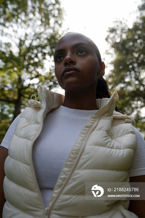 Portrait of young woman relaxing in park