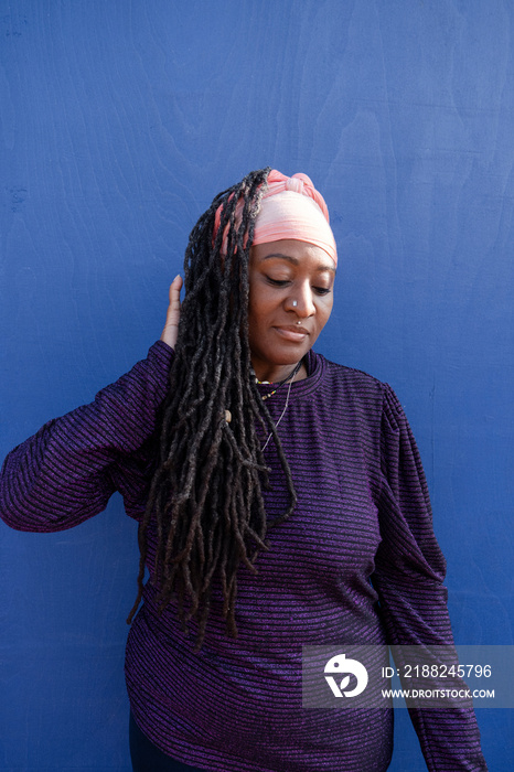 Portrait of beautiful woman with dreadlocks wearing turban