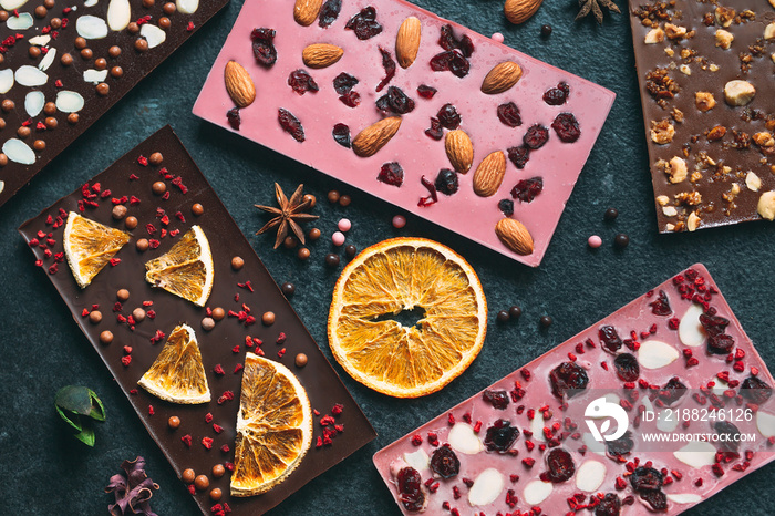 Handmade chocolate bars with a variety of dried fruit and nut toppings.