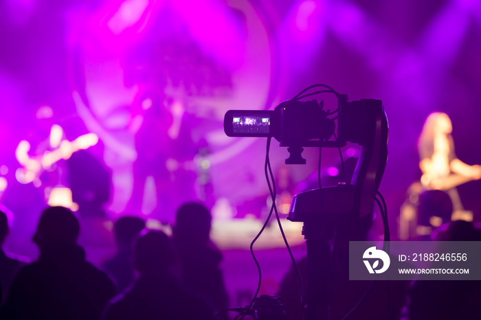 video camera recording concert show at night