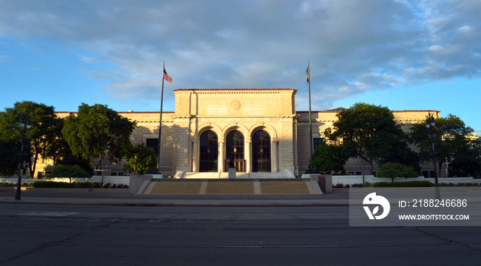 Detroit Institute of Art Buolding at evening sun, with storm behind it