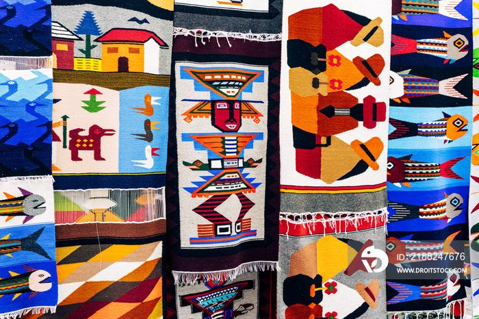 Colorful Andean fabric textiles on the local souvenir market in Otavalo, Ecuador. South America.