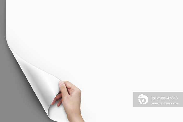 Close up of women hand turning the blank page with copy space gray background.