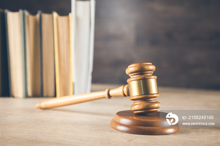 wooden judge with books on the wooden table background