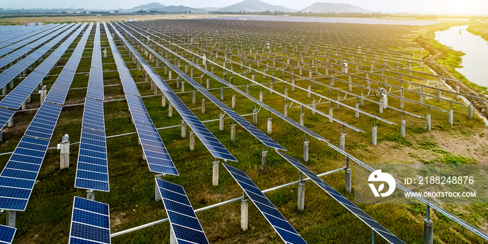 Aerial photography of solar photovoltaic cell panels illuminated by the sunset