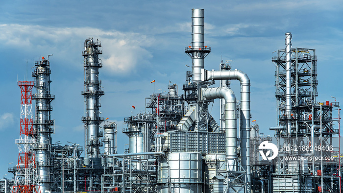 Oil and gas industrial,Oil refinery plant form industry,Refinery factory oil storage tank and pipeline steel with sunset and cloudy sky background,Thailand