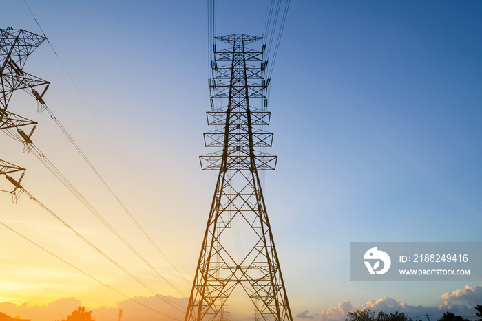 High voltage electricity pylon system, Electricity transmission power lines at sunset