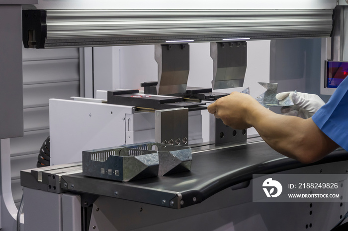 The technician operator working with hydraulic press brake bending machine.