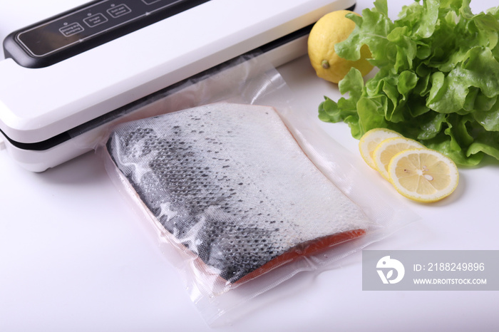 Salmon fillets in a vacuum package. Sous-vide, new technology cuisine. Selective focus, copy space