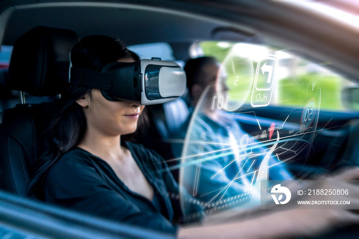 Virtual augmented reality driving user interface simulation projection holographical display screen navigation, woman driving car wearing vr headset using interface finding location travel destination