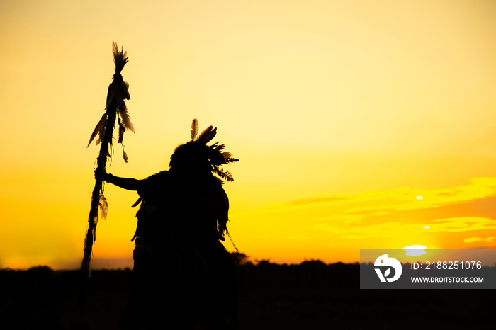 The Indians are riding a horse and spear ready to use In light of the Silhouette