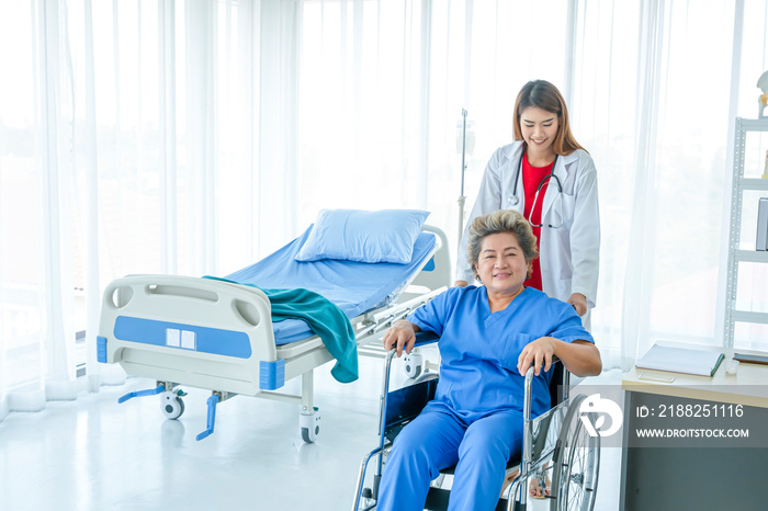 Asian doctor having checkup for a senior patient taken by soft focus technique