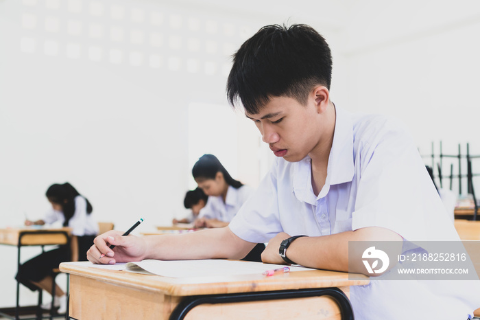 teacher helping student in classroom