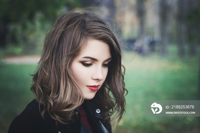 Lovely Girl in the Park. Pretty Woman with Long Bob Hair