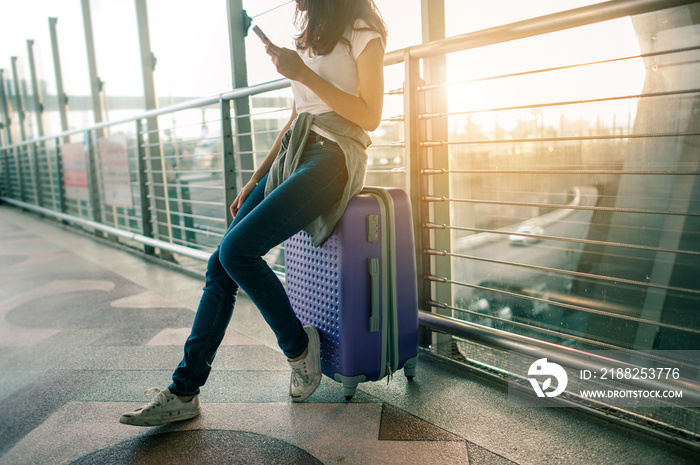 Women are using their smartphones to Flight Checking at airports.airports and technology concept