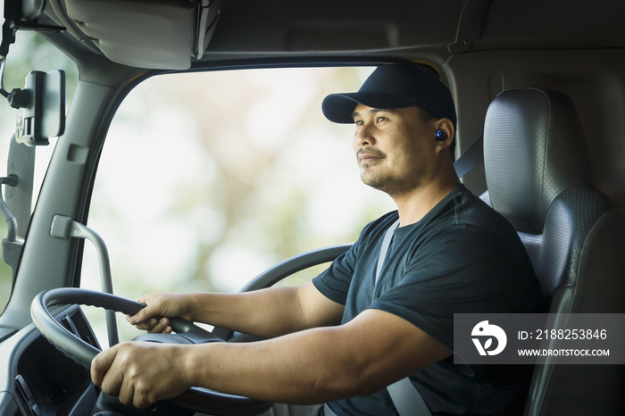 Truck driver is driving a transport vehicle.