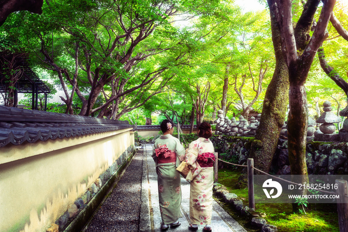 Kyoto, Japan Culture Travel - Asian traveler wearing traditional Japanese kimono walking in temple garden in the old town of Kyoto, Japan.