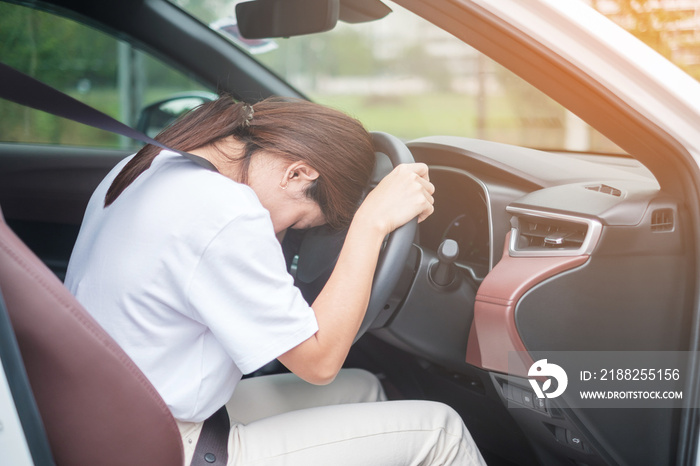 woman feeling stress and angry during drive car long time. Asian girl tired and fatigue having headache stop after driving car in traffic jam. Sleepy, stretching and drunk concept