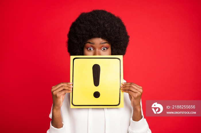 Photo of impressed curly hairdo young lady hold sign wear white sportswear isolated on red color background