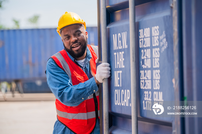 African American worker concept, African American worker working in warehouse containers for logistic import export, Black man worker