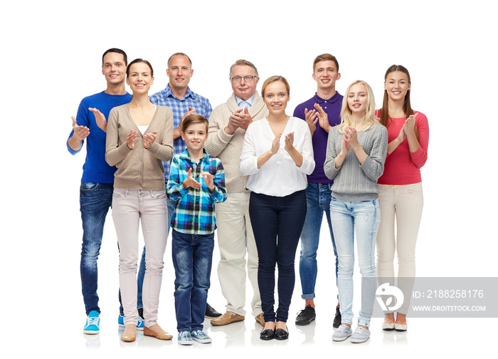 group of smiling people applauding