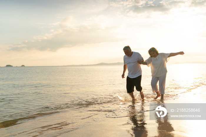 Family On Summer Beach Vacation, healthy older couple running on sea beach, Concept for .caring for the elderly, Caregiving to older persons and relations of the family to support elderly state