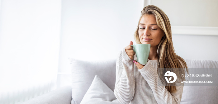 Side view of Happy brunette woman drinking coffee. Middle aged woman drinking tea while thinking. Relaxing and thinking while drinking coffee.