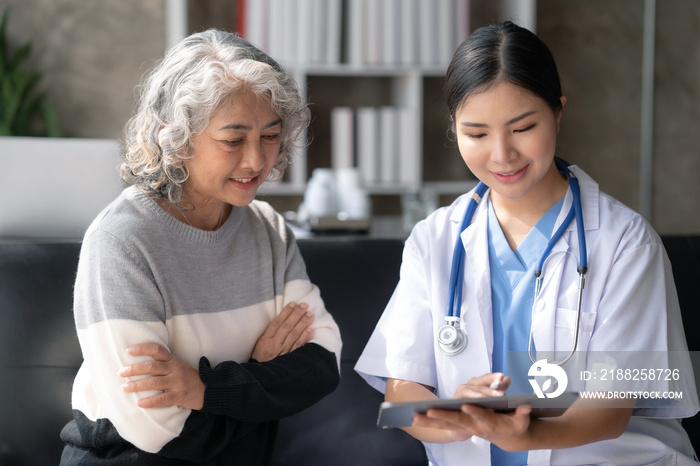 Asian female doctor examining a patient to assess the illness for proper treatment.