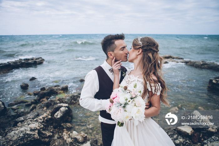 Beautiful wedding couple by the sea