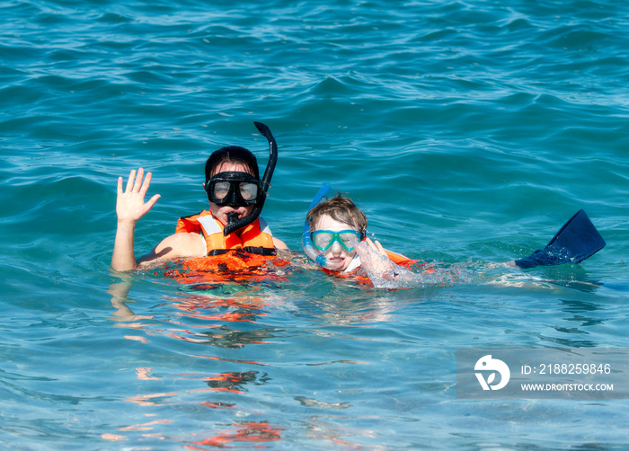 Mother and Young Son Snorkeling with Life Jackets in the Ocean at Punta Mita, Nayarit, Mexico