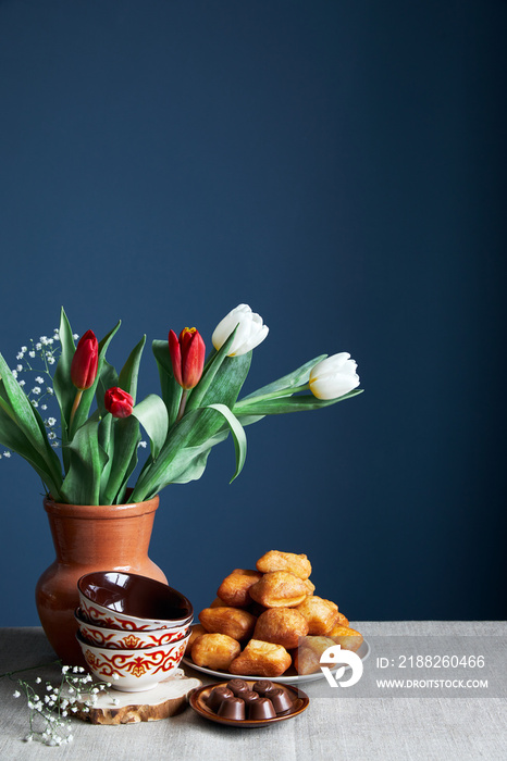 Kazakh national dish, bread baursaks and tulips on Nauryz festival