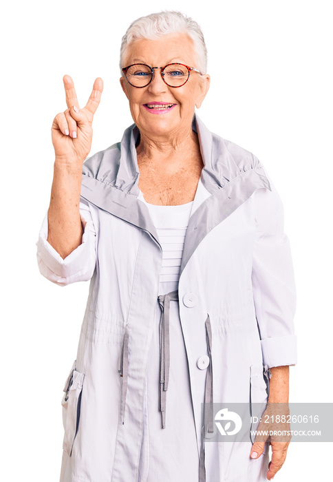 Senior beautiful woman with blue eyes and grey hair wearing casual clothes and glasses showing and pointing up with fingers number two while smiling confident and happy.