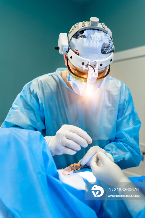 Plastic surgeon in operation room. Portrait of a male surgeon. Cosmetolody surgery concept.