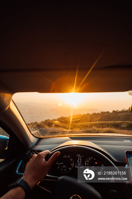 The road to success - a driver traveling on a road