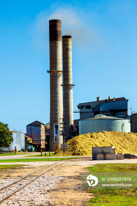 Smoke coming out of chimney stacks of sugar mill in north Queensland.