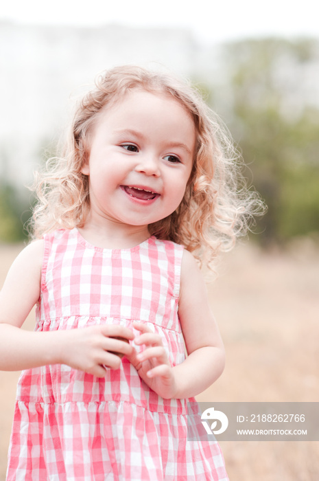 Happy child 2-3 year old running outdoors closeup. Summer time. Childhood.