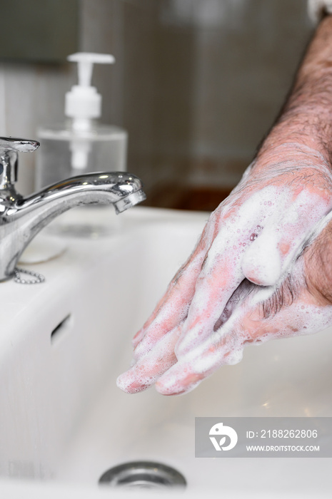 Close up of Senior man washing his hands using soap foam, Prevention from covid19, Coronavirus or Bacteria. Healthcare concept, 7 step hands wash .