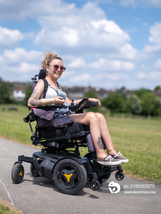 Woman in electric wheelchair going on walk