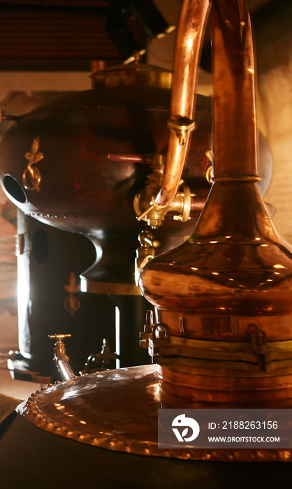 medieval traditional distiller, cube made from copper production of alcohol, cognac, whiskey. Fragment of copper old distiller for alcohol production. Ancient traditional food technologies for alcohol