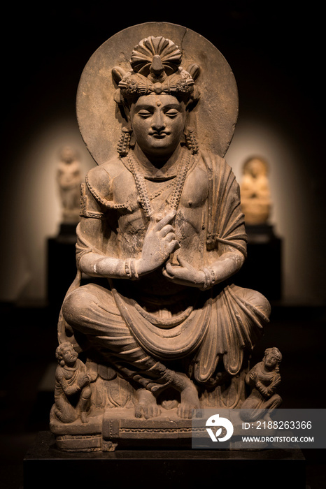 ancient cross-legged Bodhisattva schist statue image in 2nd century, Kushan dynasty from Gandhara, Pakistan.