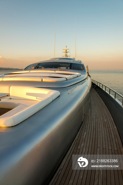 Beautiful sea view from the starboard side of a luxury yacht at sunset / sunrise - vertical orientation