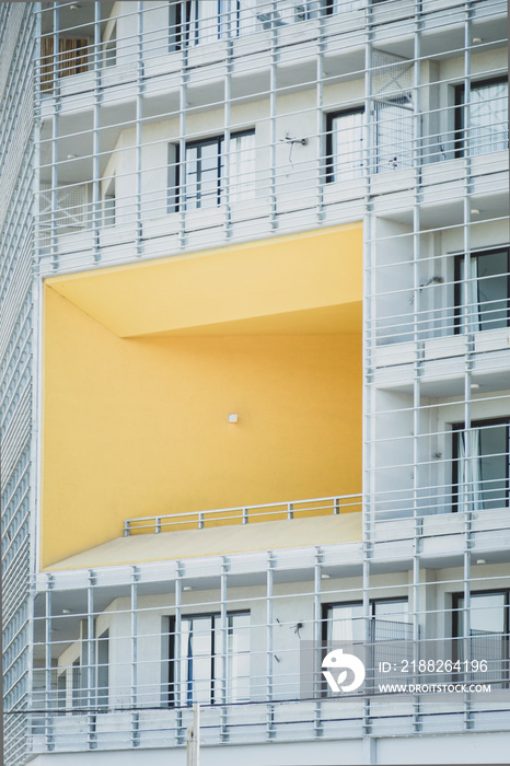 A white building with a yellow sector