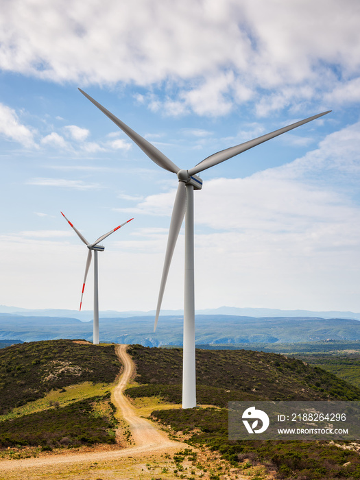 Turbines in a mountain wind farm. Ecological energy production.