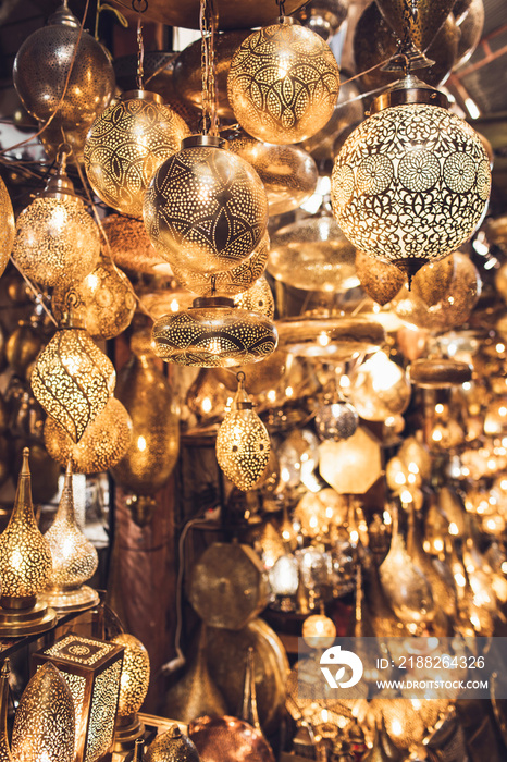 Traditional moroccan souvenir lamps on local market souk in Marrakesh medina. Handmade work, different shapes.