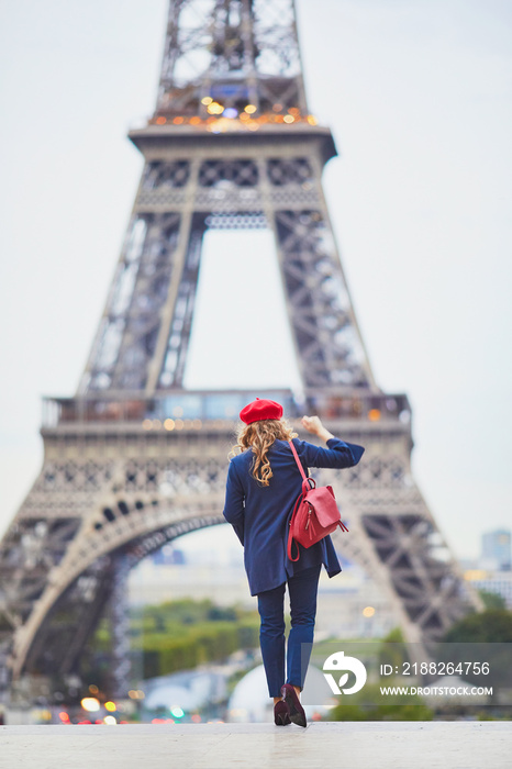 Young woman with long blond curly hair in Paris, France