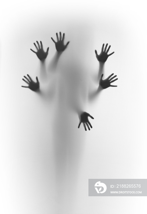 Blurred human body shape spirit stands behind diffuse surface, six hands can be seen sharply, fingers and palms.