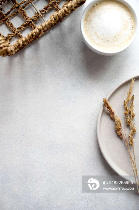 Still life cup of coffee and decorative dried flowers in vase flatlay template